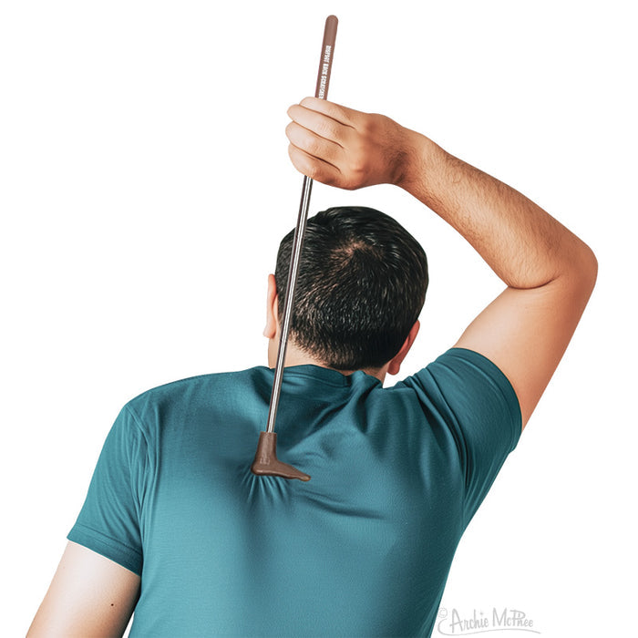 A person scratching their back with the Bigfoot Back Scratcher, which features an extendable handle and a design inspired by the legendary creature.