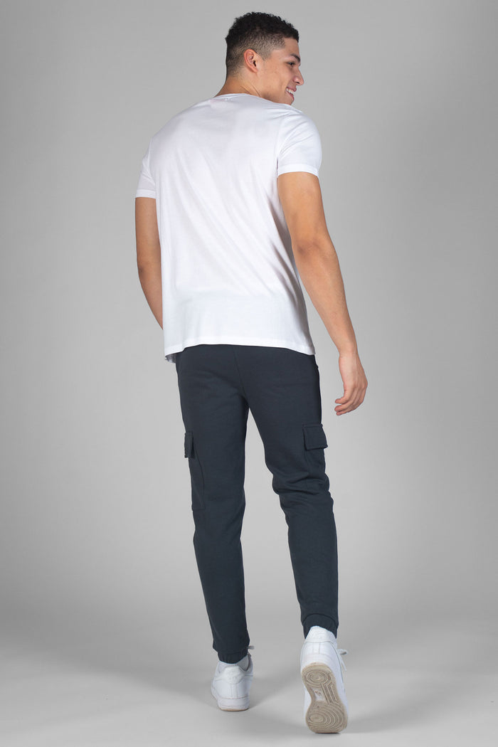 Man wearing charcoal Cargo jogging trousers with pockets and white t-shirt