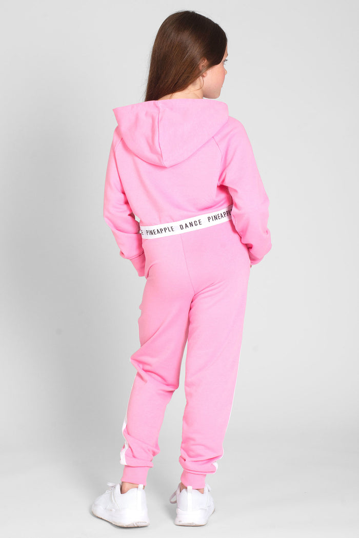Girl wearing pink Mesh Slim Track Pants with contrast stripes and matching crop hoodie