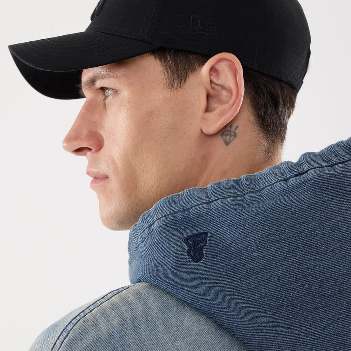 The model is wearing this New Era Washed Full Zip Hoodie in blue. 7
