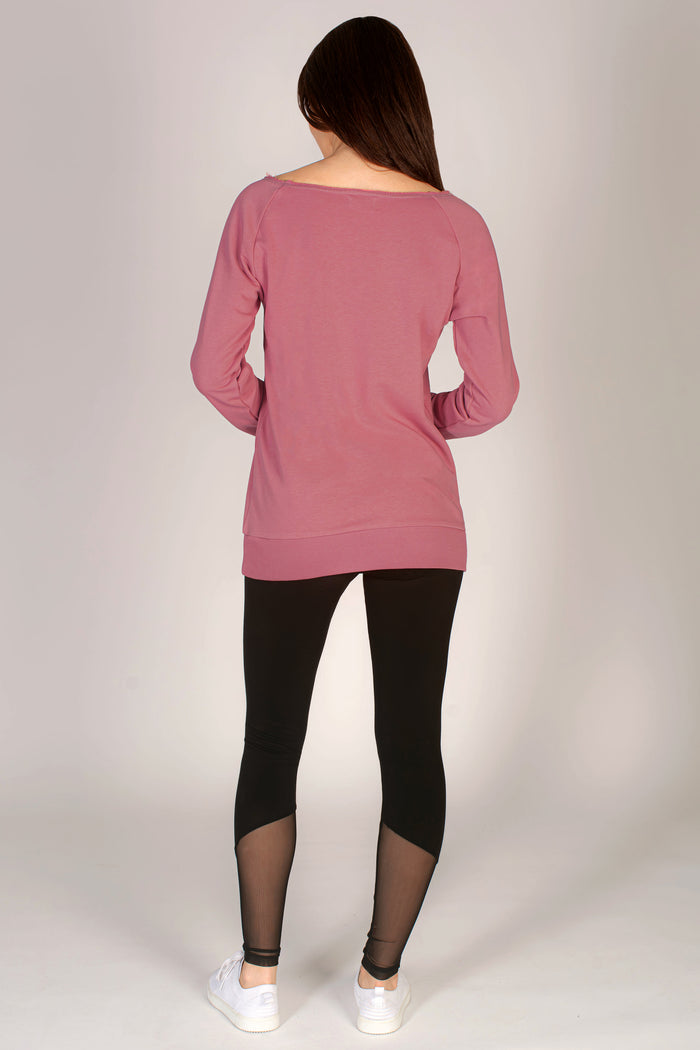 Women's dusty pink longline sweatshirt paired with black leggings