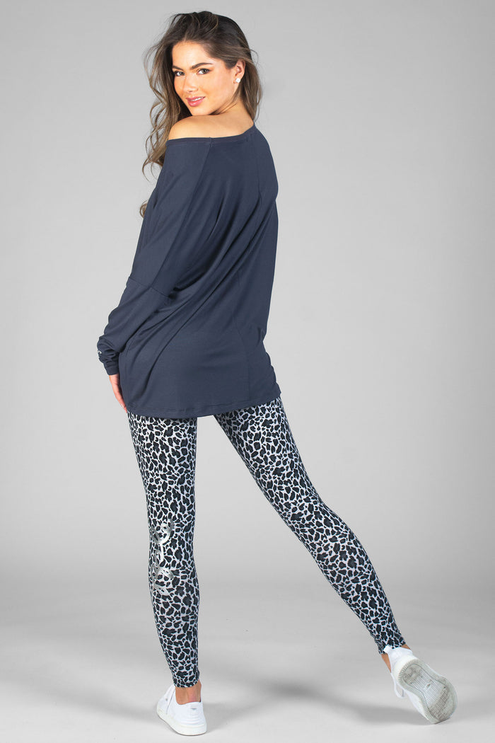 Woman wearing off shoulder Charcoal Script Long Sleeve T-Shirt and Charcoal Leopard Print Legggings