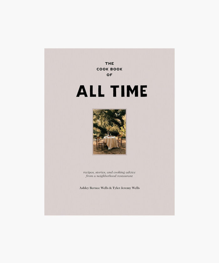 Cookbook cover titled 'The Cookbook of All Time' with a photo of a table outdoors. | SW Home