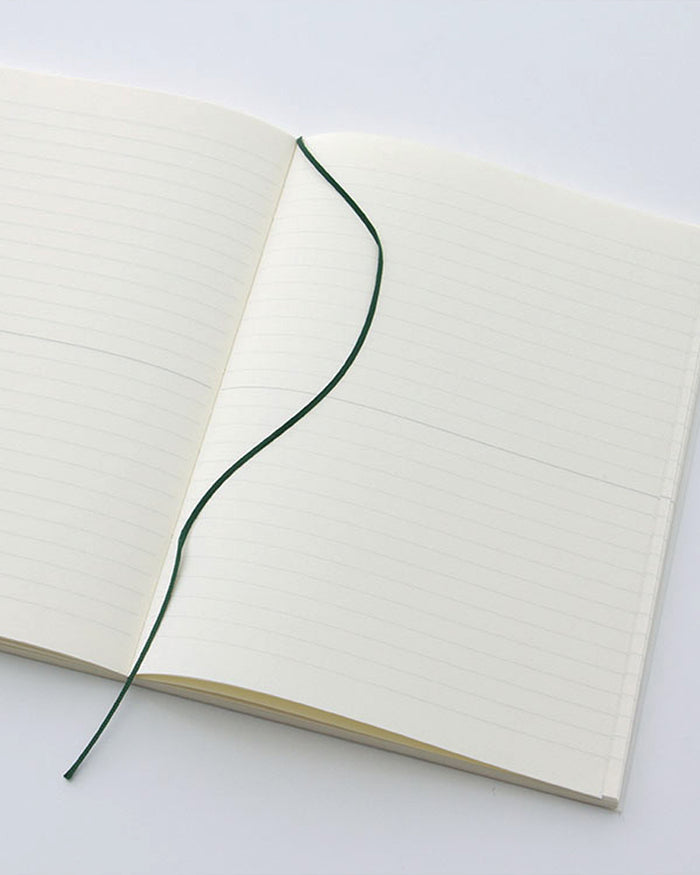 Open midori ruled a5 notebook with a black ribbon bookmark in the center.