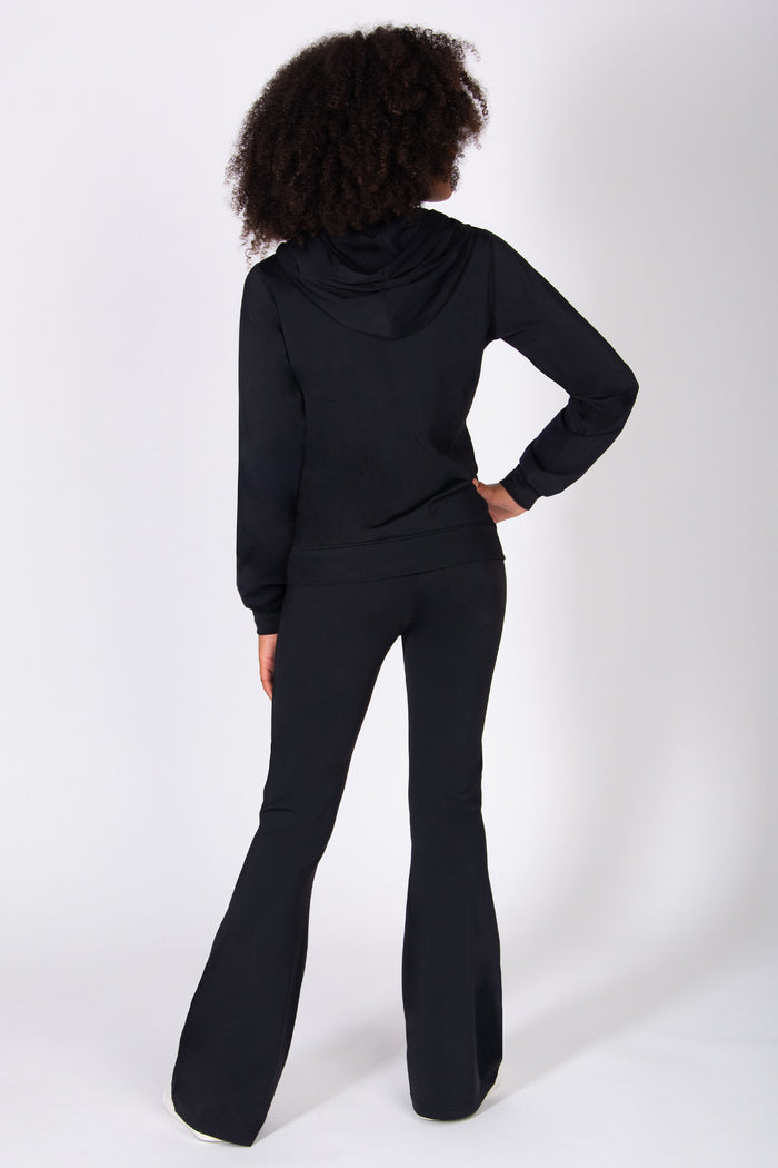 Girl wearing a black outfit on a white background