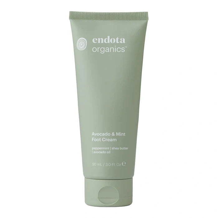 Green tube of endota organics Avocado & Mint Foot Cream 90ml on a white background