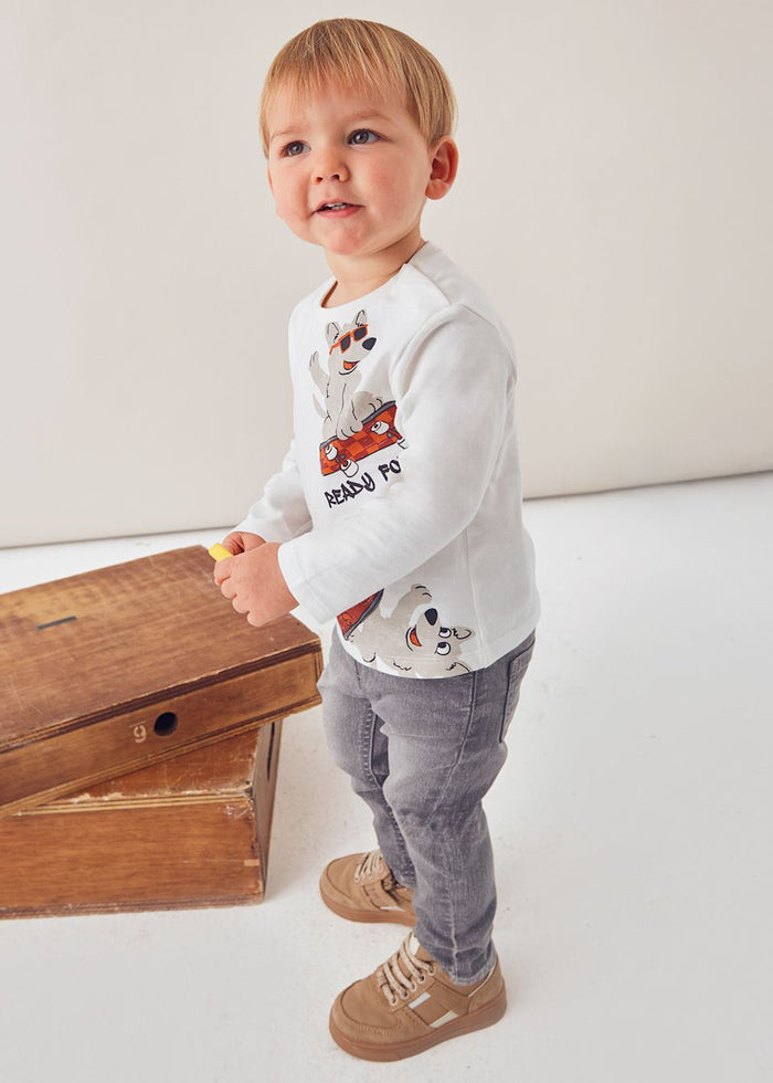 Side view of toddler in Mayoral animal print long-sleeve tee for daycare and play.