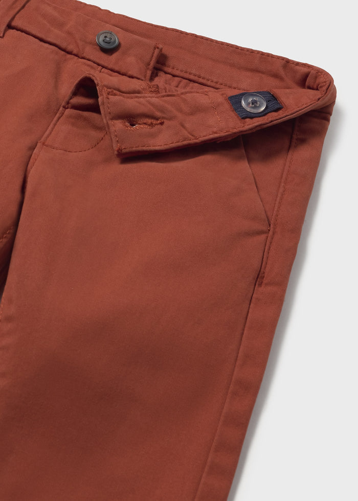 Closeup of Mayoral baby chinos showing adjustable waistband, button detail, and micro-corduroy texture.