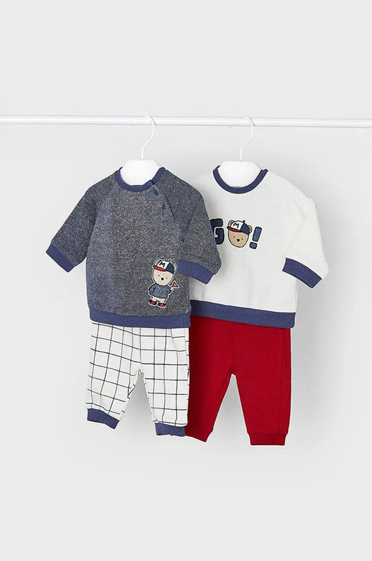 Mayoral baby boy 4-piece knit outfit set with navy graphic top, white graphic top, red pants, and check pants.