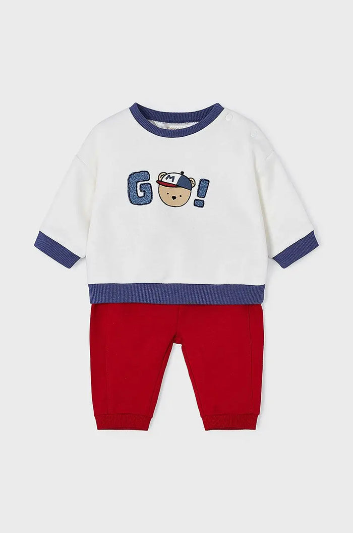 Mayoral baby boy outfit set showing white graphic top with red pants in soft cotton stretch knit.