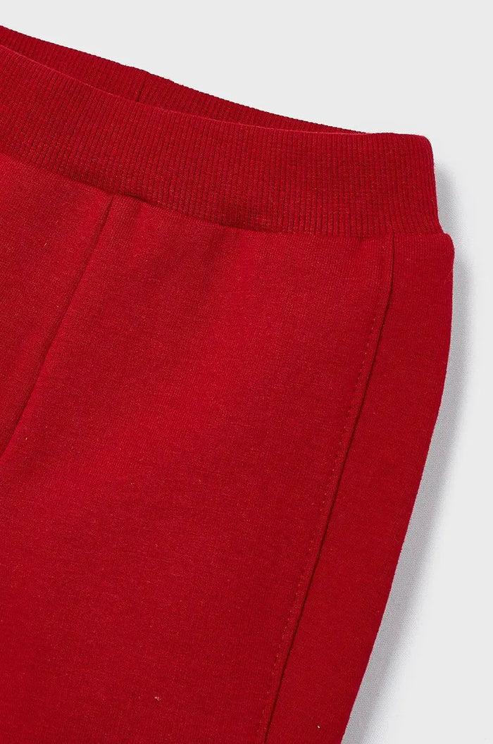 Close-up of Mayoral baby boy red pants showing elastic waist and soft cotton stretch fabric.