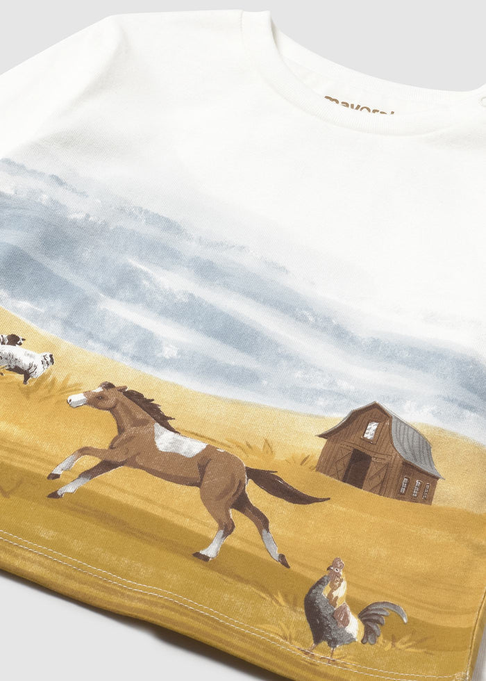 Closeup of Mayoral baby t-shirt showing landscape print, soft fabric, and long-sleeve detail.