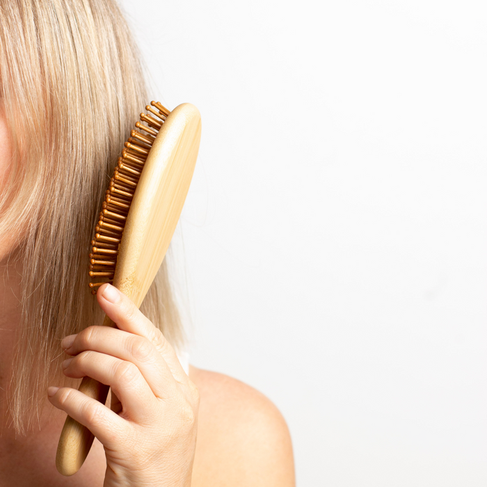 Ever Eco hair brush being used on fine blonde hair.
