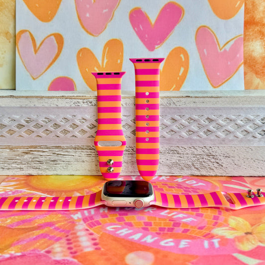 Candy Citrus Stripes Apple Watch band with bold pink and orange horizontal stripes with heart backdrop