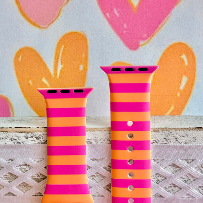 Candy Citrus Stripes Apple Watch band with bold pink and orange horizontal stripes with heart backdrop