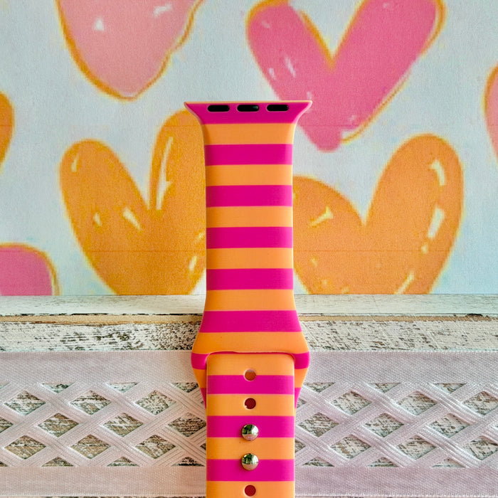 Candy Citrus Stripes Apple Watch band with bold pink and orange horizontal stripes with heart backdrop