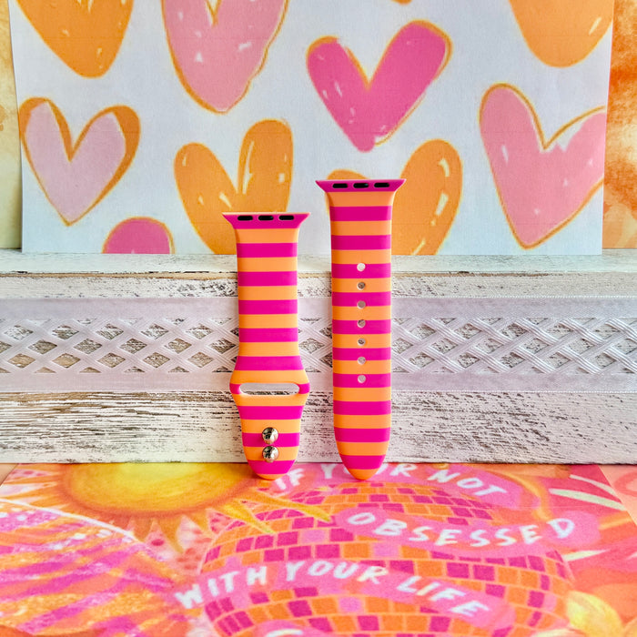 Candy Citrus Stripes Apple Watch band with bold pink and orange horizontal stripes with heart backdrop