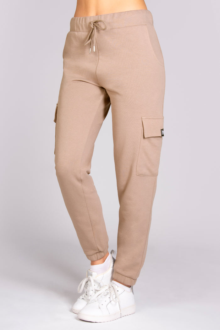 Women's cargo joggers in nude colour with side pockets and adjustable waistband