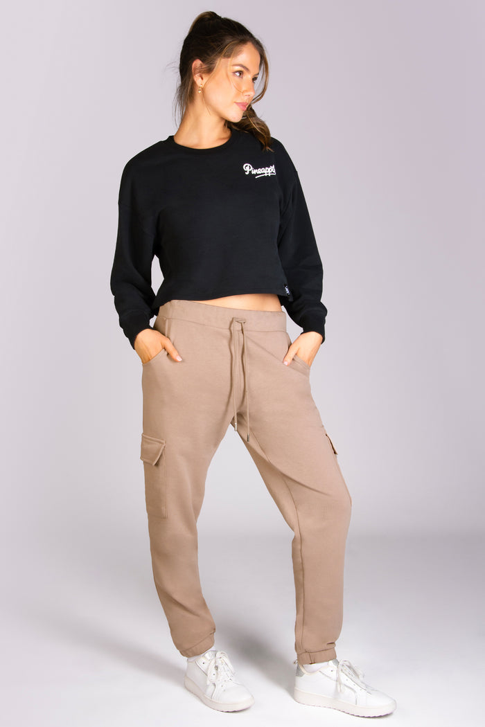 Kianna Louise wearing nude cargo joggers with Pineapple sweater