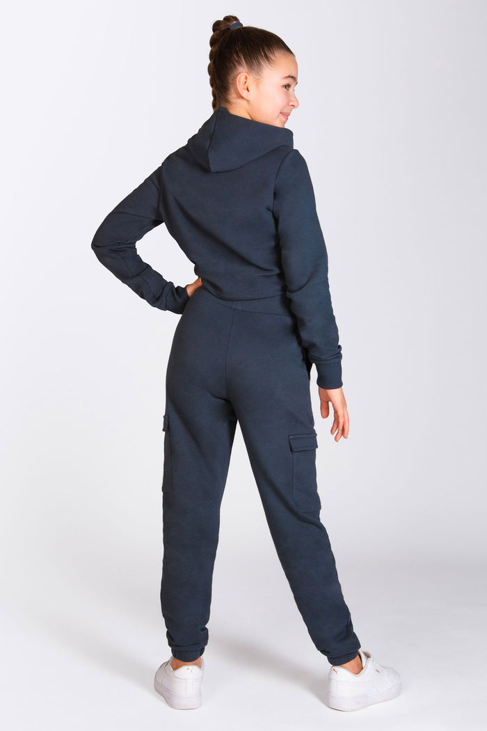 Dark grey cargo style trousers for girls with 4 pockets and small Pineapple Dance Studio branded tape.