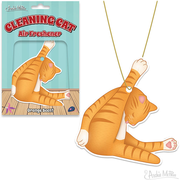 The Cleaning Cat Air Freshener features a cartoon cat design in the midst of grooming itself, presented in packaging with a wooden floor background. It offers a delightful citrus scent to keep any environment refresh.