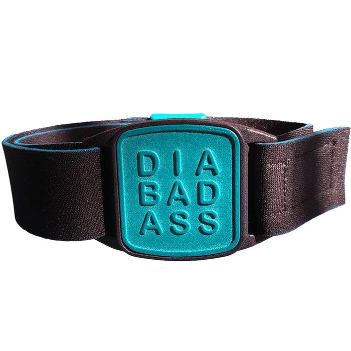 Dexband CGM armband for Dexcom G7 and ONE+ sensors with teal Diabadass cover and neoprene strap. LML4047, LML4054, LML4061, LML5044.
