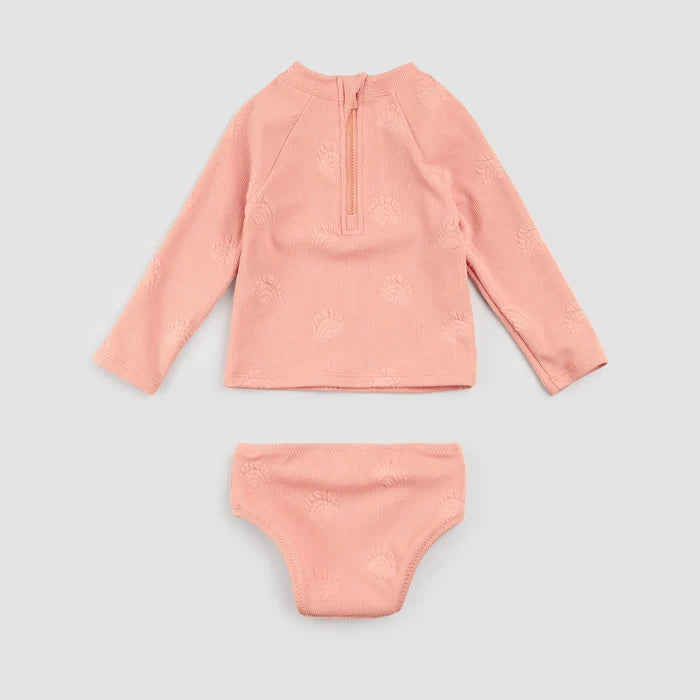 Front view of long-sleeve coral rashguard and matching bikini bottoms laid out together for kids swim set