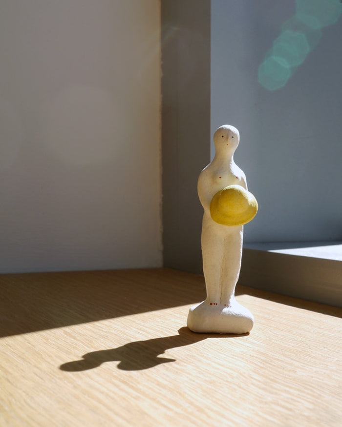 Figurine of Woman with Rain Hat (OUT OF STOCK)