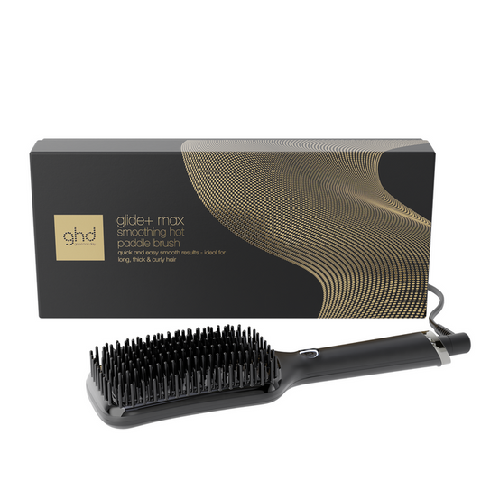 Black paddle brush with ghd packaging on a white background