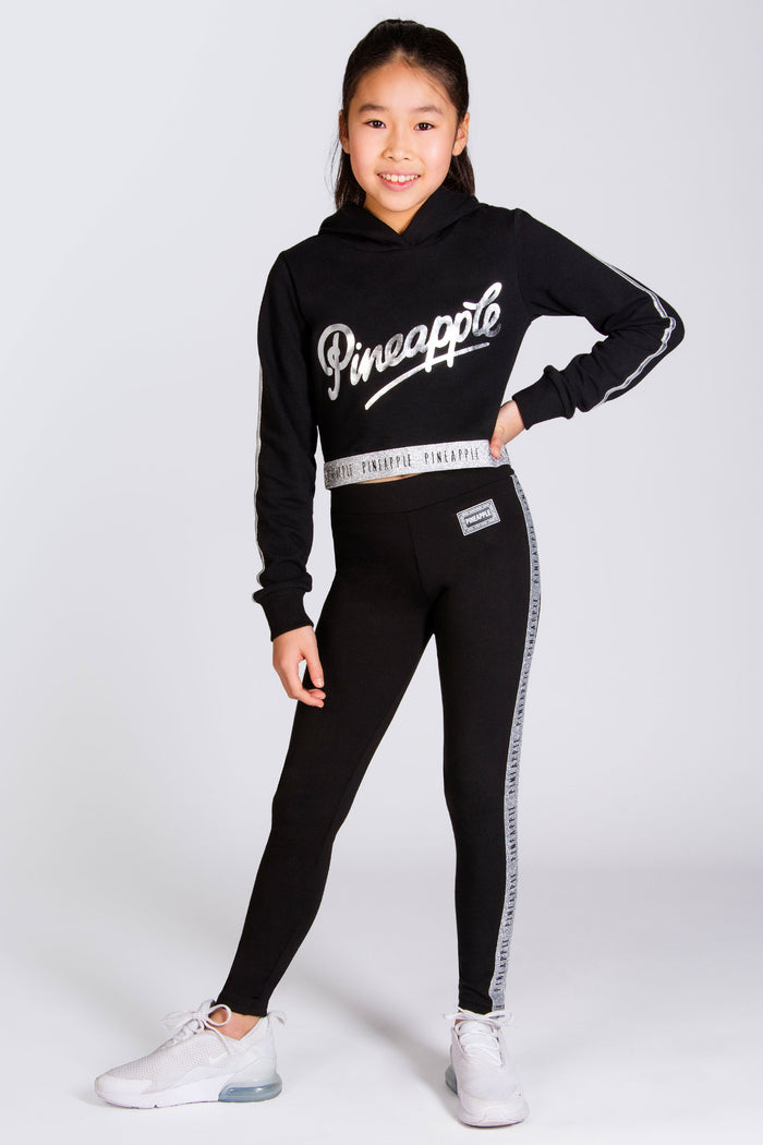 Black leggings for girls decorated with silver foil tape.