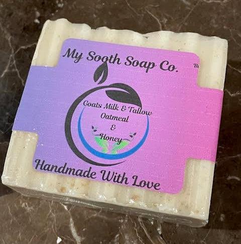 Bar of soap with a purple label on a marbled surface