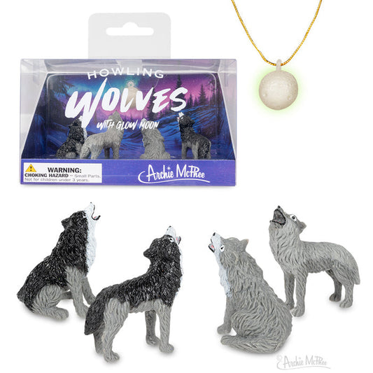 The Howling Wolves Playset includes four detailed wolf figures and a glow-in-the-dark moon necklace, all presented in striking packaging.