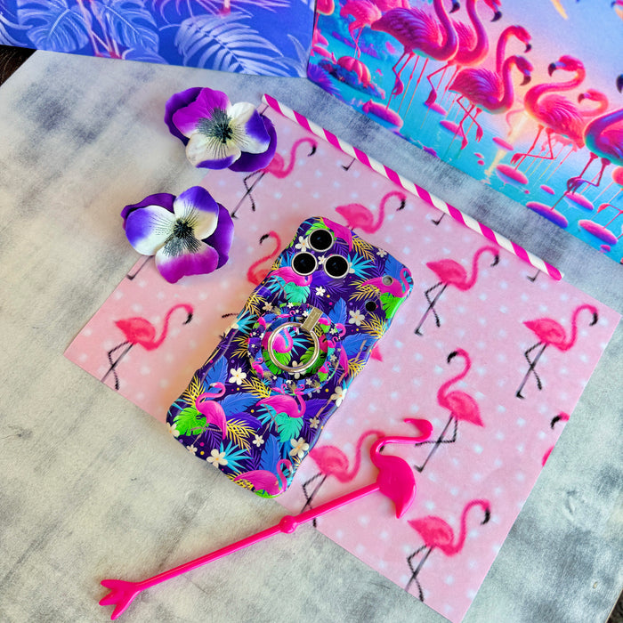 It's Giving Flamingo Wavy Luxe iPhone case with the matching MagSafe grip ring attached, styled on pink flamingo print paper.