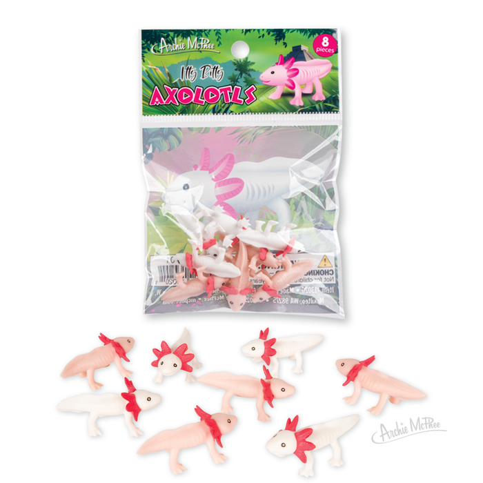 Itty Bitty Axolotls, small pink and white soft vinyl figures with red frills resembling baby axolotls, are shown alongside their package on a white background.