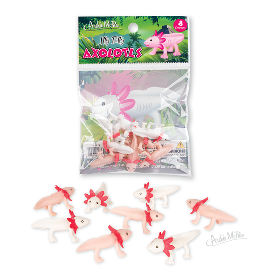 Itty Bitty Axolotls, small pink and white soft vinyl figures with red frills resembling baby axolotls, are shown alongside their package on a white background.