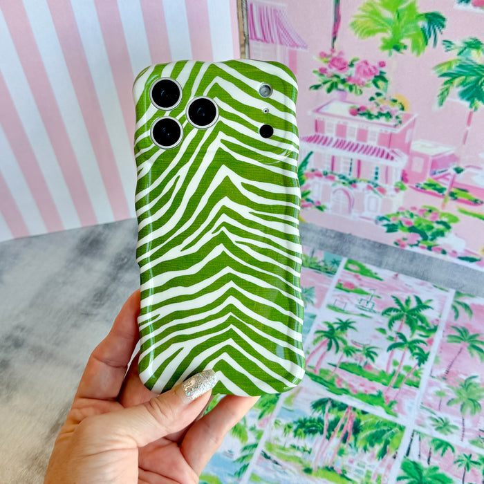 Trendy palm green and white wavy iPhone case featuring a bold zebra print pattern with a high-gloss finish.