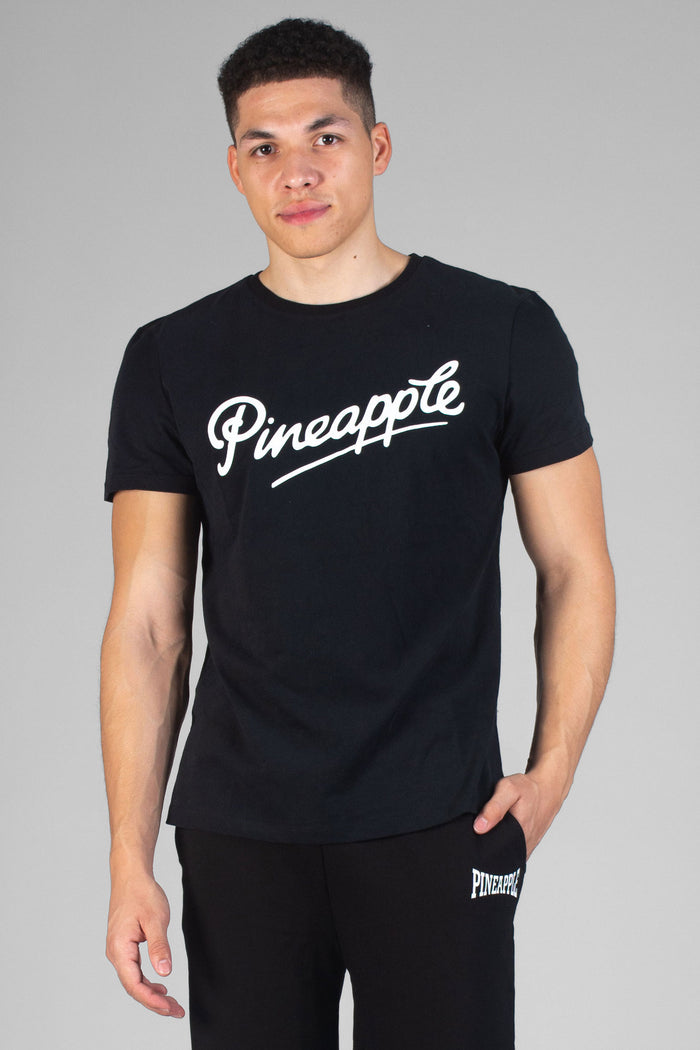 Man wearing Pineapple black Logo T-Shirt