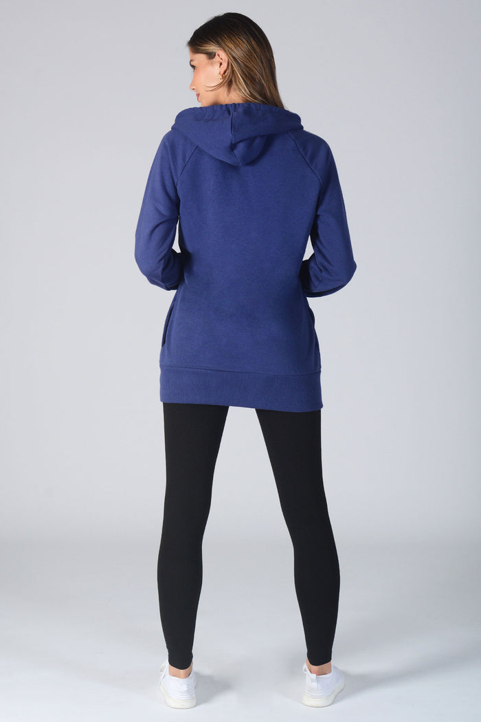 Woman wearing navy Loopback Longline Hoodie and black leggings