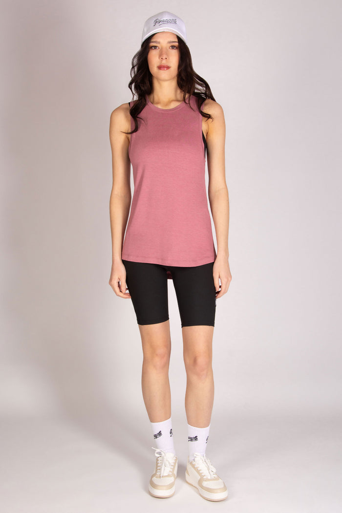 Martyna Balsam wearing a pink longline vest with dropped armholes and scooped back
