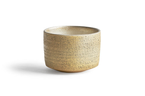 Silhouetted image of the uchugin silver matcha bowl against white background.