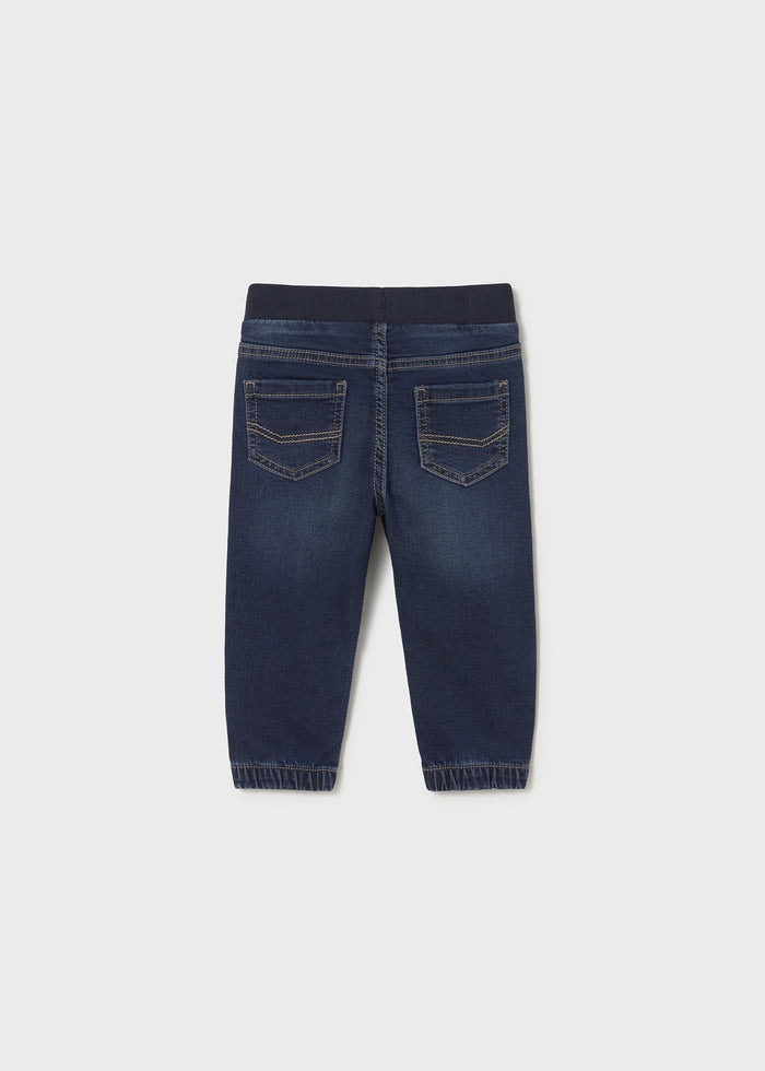 Back view of denim joggers highlighting comfy fit and stitching.