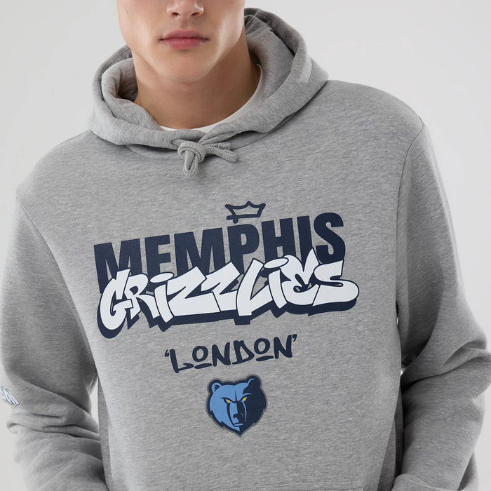 The model is wearing this NBA London Game 2026 Memphis Grizzlies Pullover Hoodie in grey. 3