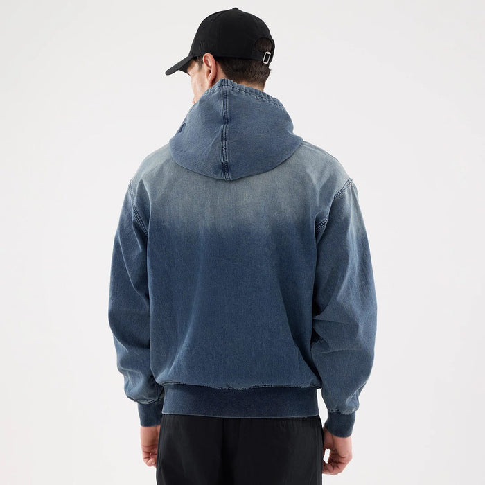 The model is wearing this New Era Washed Full Zip Hoodie in blue. 2