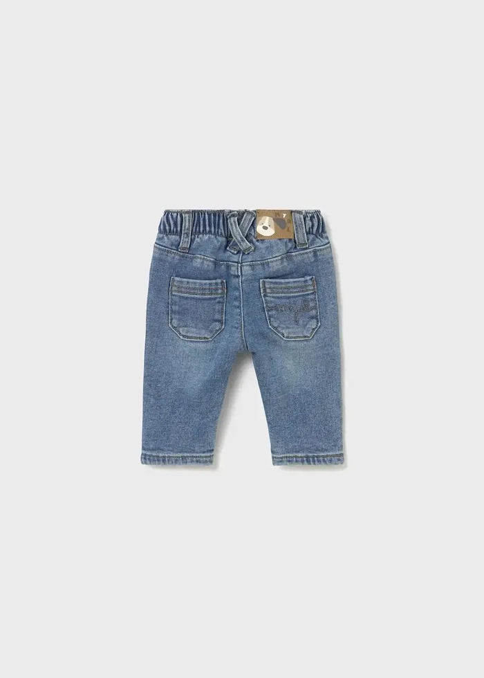 Back view of Mayoral newborn baby boy jeans showing light wash and functional back pockets.