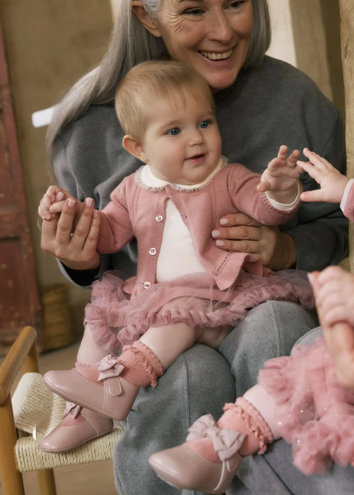 Front view newborn 3-piece set with ruffle skirt — almost gone