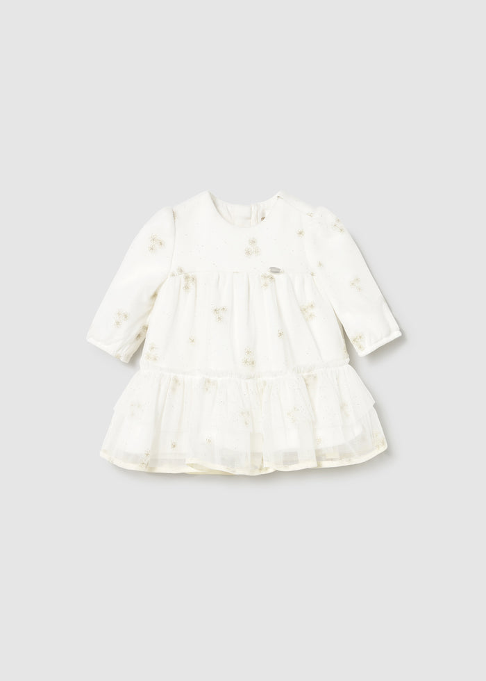 Front view of Ivory/Gold dot tulle baby dress with long sleeves and gathered skirt.