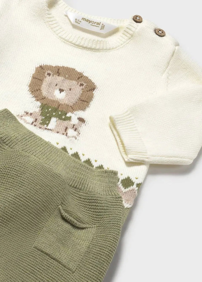 Closeup of Mayoral newborn knit sweatshirt showing shoulder buttons and soft jacquard detail.