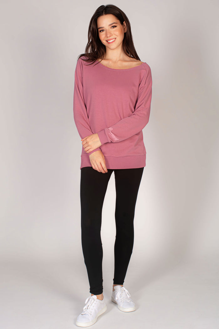 Pink longline sweat top for women paired with black leggings
