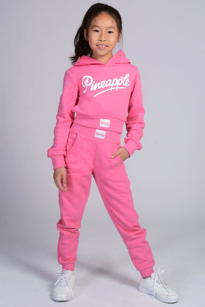 Young girl wearing Ombre Logo Crop Hoodie and matching Ombre Stripe Joggers