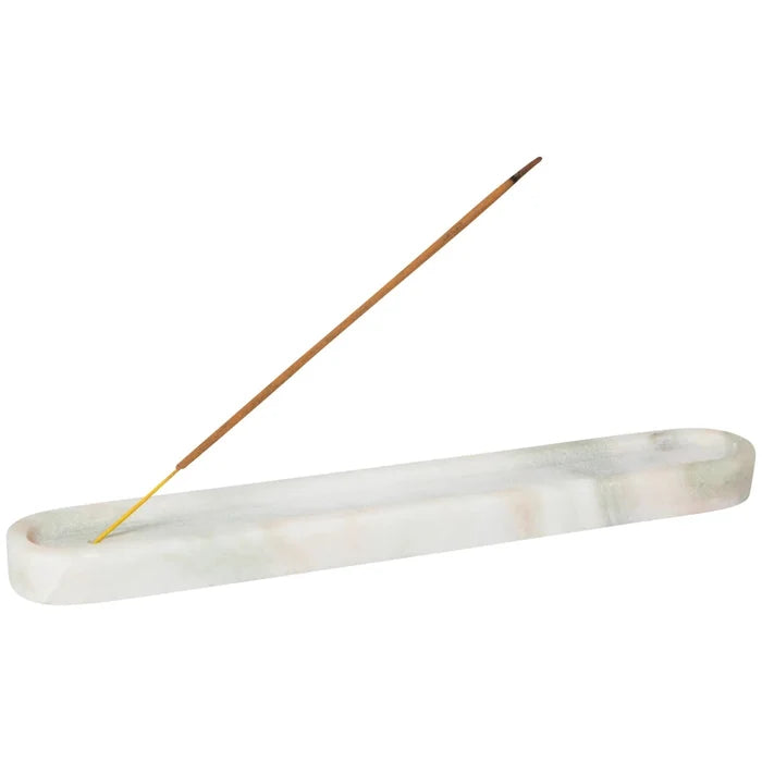 A white marble incense holder with a single brown incense stick